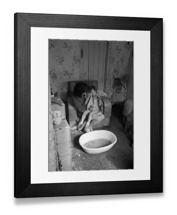 Framed Print : Woman bathing baby, Falls Road, Northern Ireland Framed Print : Woman bathing baby, Falls Road, Northern Ireland