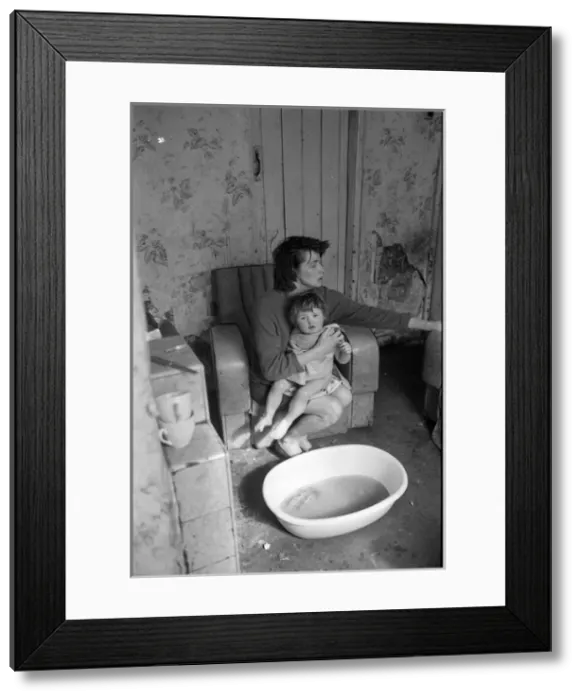 Framed Print : Woman bathing baby, Falls Road, Northern Ireland Framed Print : Woman bathing baby, Falls Road, Northern Ireland