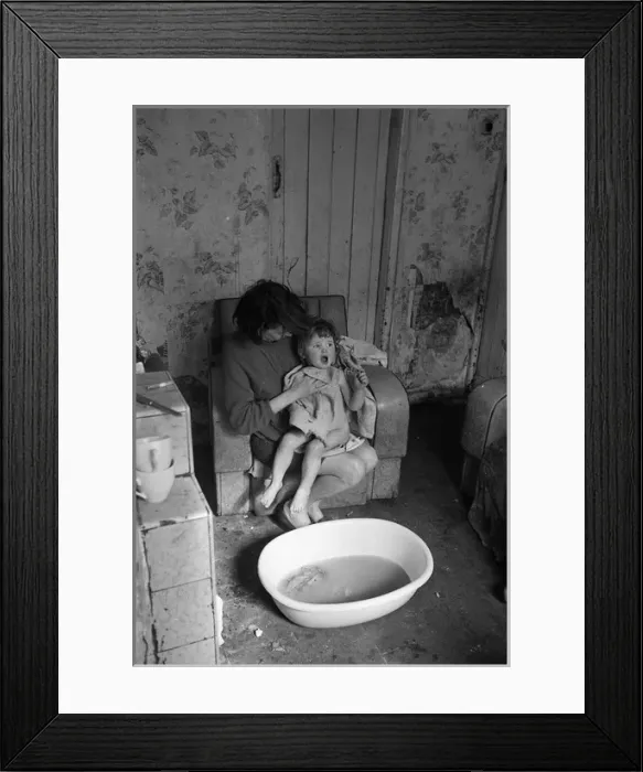 Framed Print : Woman bathing baby, Falls Road, Northern Ireland Framed Print : Woman bathing baby, Falls Road, Northern Ireland