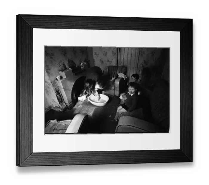 Framed Print : Woman bathing baby, Falls Road, Northern Ireland Framed Print : Woman bathing baby, Falls Road, Northern Ireland