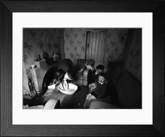 Framed Print : Woman bathing baby, Falls Road, Northern Ireland Framed Print : Woman bathing baby, Falls Road, Northern Ireland