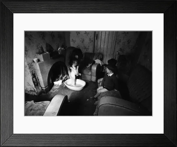 Framed Print : Woman bathing baby, Falls Road, Northern Ireland Framed Print : Woman bathing baby, Falls Road, Northern Ireland