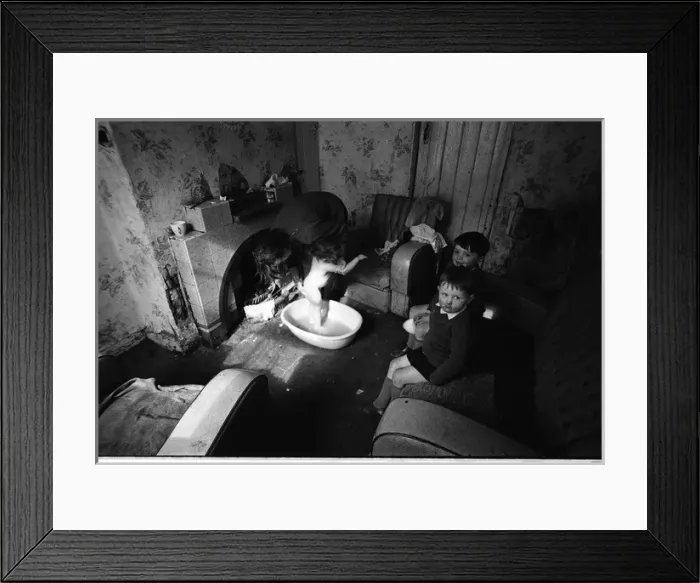 Framed Print : Woman bathing baby, Falls Road, Northern Ireland Framed Print : Woman bathing baby, Falls Road, Northern Ireland