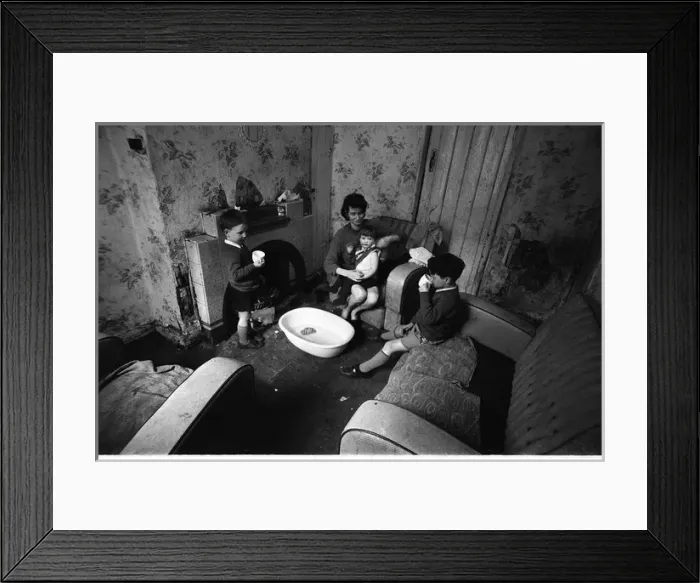 Framed Print : Woman undressing baby, Falls Road, Northern Ireland Framed Print : Woman undressing baby, Falls Road, Northern Ireland