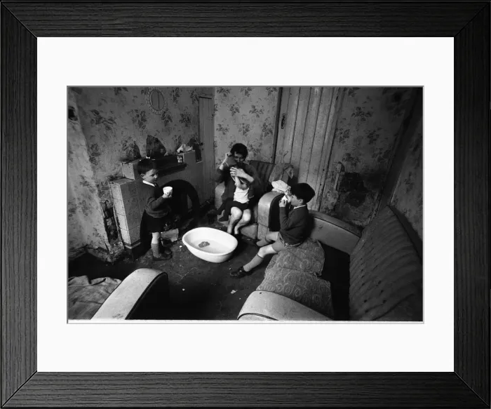 Framed Print : Woman undressing baby, Falls Road, Northern Ireland Framed Print : Woman undressing baby, Falls Road, Northern Ireland