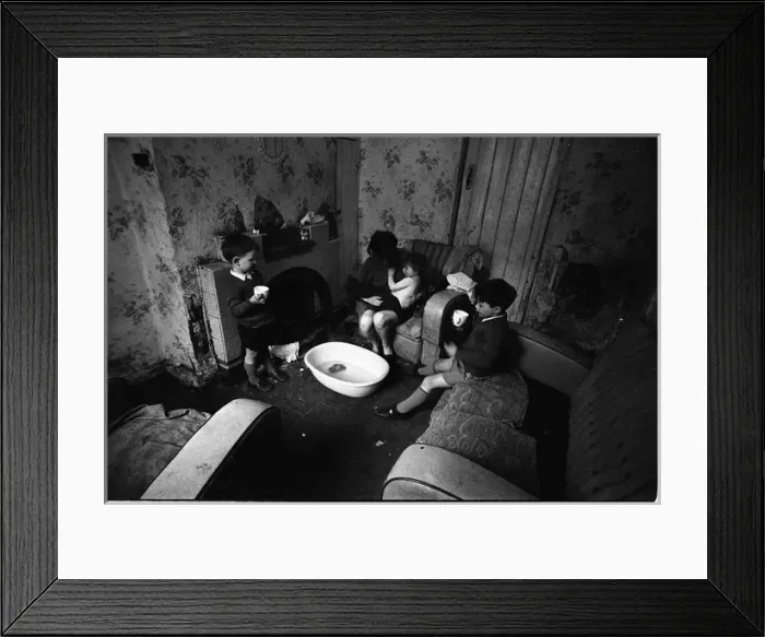 Framed Print : Woman undressing baby, Falls Road, Northern Ireland Framed Print : Woman undressing baby, Falls Road, Northern Ireland