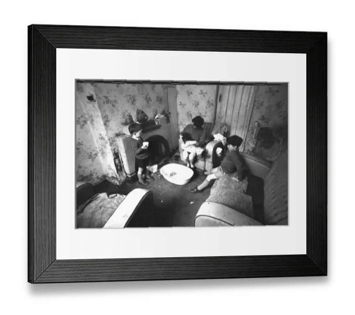 Framed Print : Woman undressing baby, Falls Road, Northern Ireland Framed Print : Woman undressing baby, Falls Road, Northern Ireland