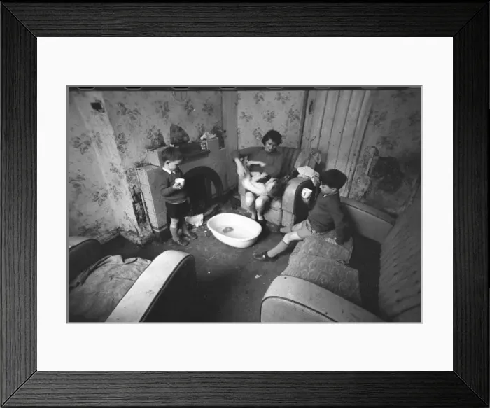 Framed Print : Woman undressing baby, Falls Road, Northern Ireland Framed Print : Woman undressing baby, Falls Road, Northern Ireland