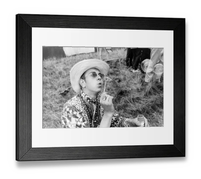 Framed Print : Hippy man blowing bubbles at Woburn Park Framed Print : Hippy man blowing bubbles at Woburn Park