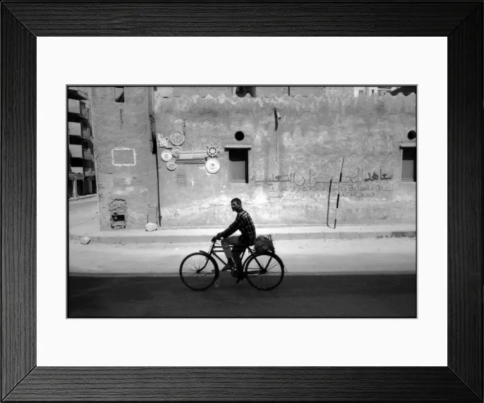 Framed Print : Young man on bike Cairo street, Egypt Framed Print : Young man on bike Cairo street, Egypt