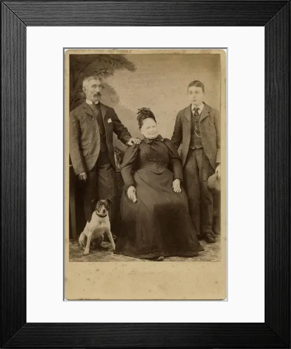 Framed Print : Studio portrait, family of three with terrier dog Framed Print : Studio portrait, family of three with terrier dog
