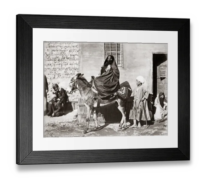 Framed Print : Veiled woman on a donkey, Egypt, circa 1880s Framed Print : Veiled woman on a donkey, Egypt, circa 1880s
