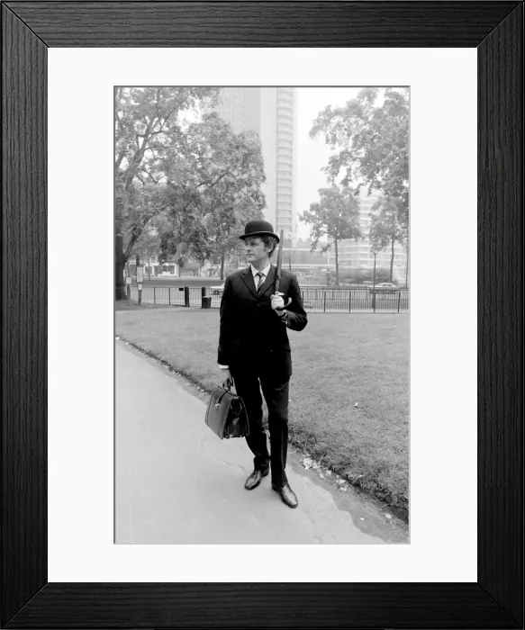 Framed Print : Bowler-hatted City gent in a park Framed Print : Bowler-hatted City gent in a park