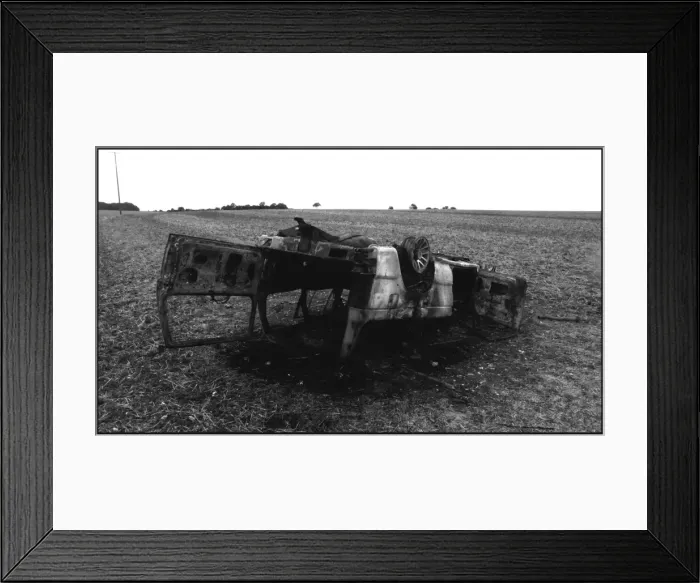 Framed Print : Burnt out car abandoned in a field Framed Print : Burnt out car abandoned in a field