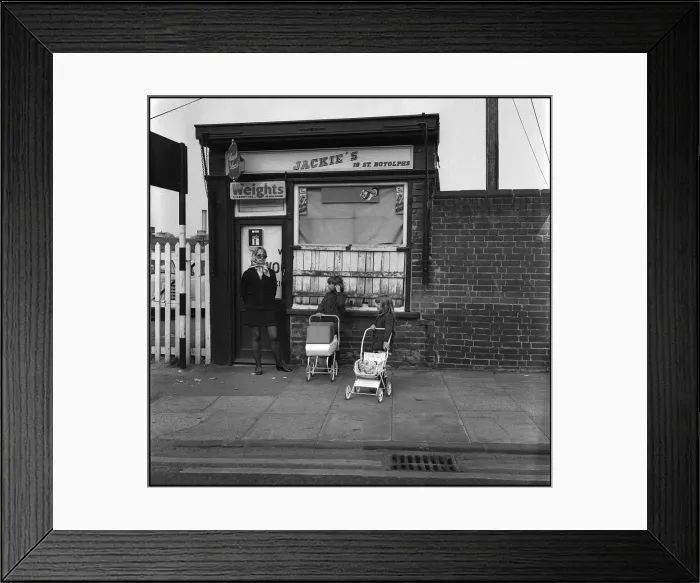 Framed Print : Young woman with children and toy prams Framed Print : Young woman with children and toy prams