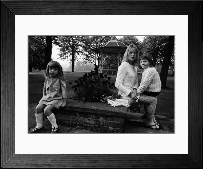 Framed Print : Young mother in a park with children bandstand and cyclist Framed Print : Young mother in a park with children bandstand and cyclist