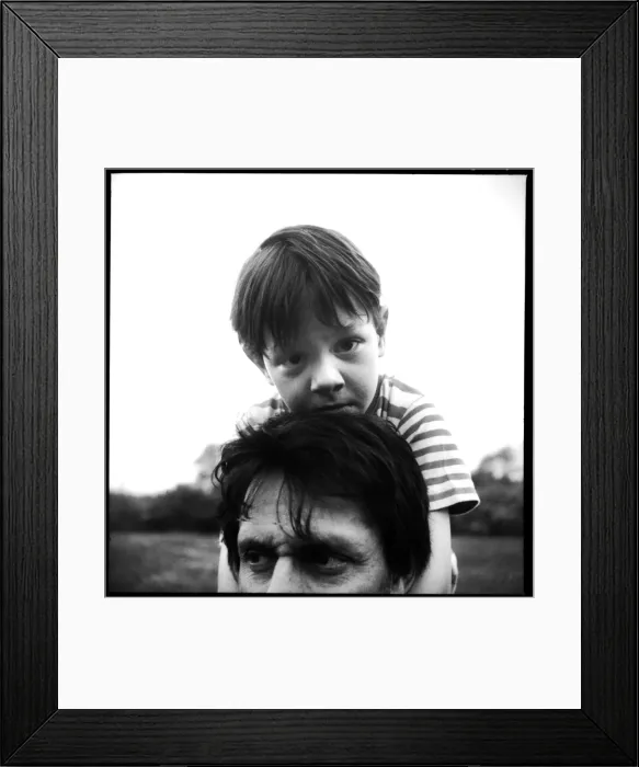 Framed Print : Portrait of a small boy on his fathers shoulders Framed Print : Portrait of a small boy on his fathers shoulders