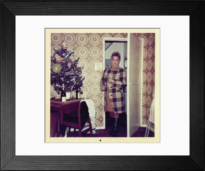 Framed Print : Woman looks surprised entering room decorated for Christmas Framed Print : Woman looks surprised entering room decorated for Christmas