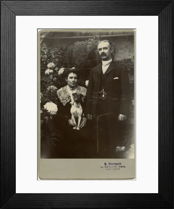 Framed Print : Edwardian couple with terrier dog in a garden Framed Print : Edwardian couple with terrier dog in a garden