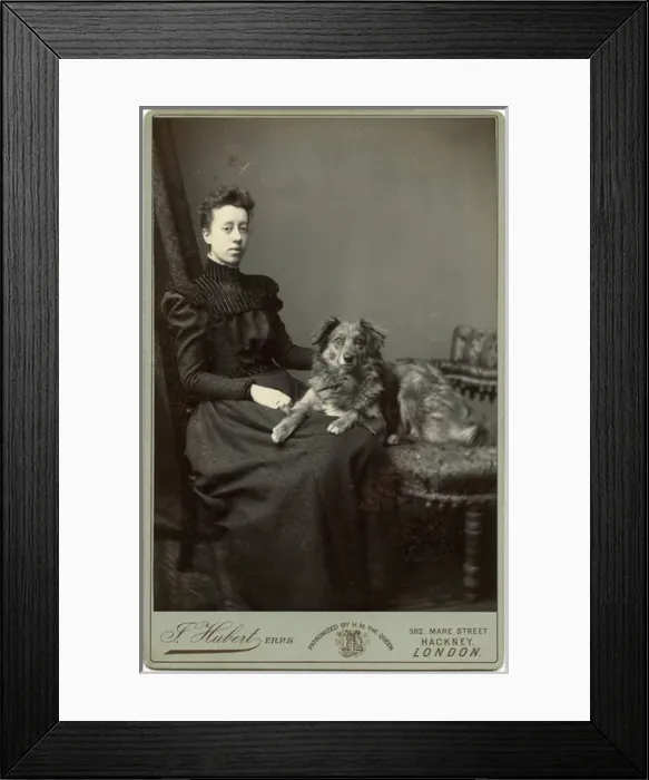 Framed Print : Studio portrait, young woman with dog Framed Print : Studio portrait, young woman with dog