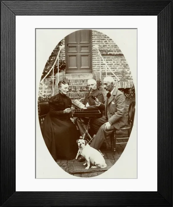 Framed Print : Three people with a dog in a garden Framed Print : Three people with a dog in a garden