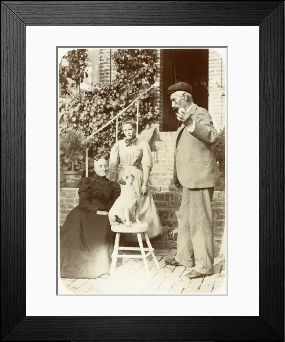 Framed Print : Three people with a dog in a garden Framed Print : Three people with a dog in a garden