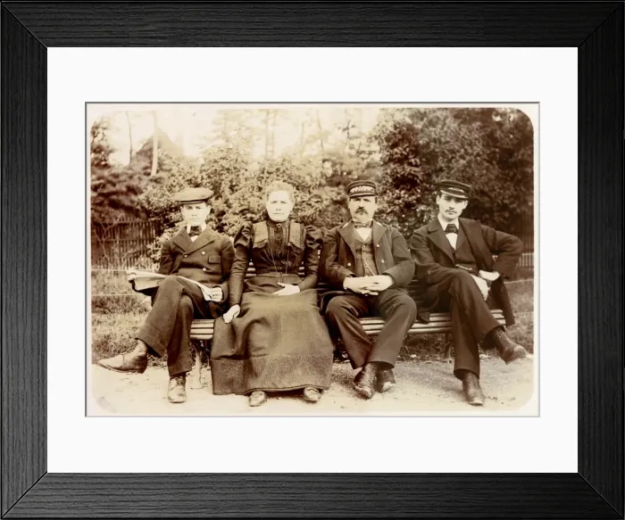 Framed Print : Four people on a bench in a garden Framed Print : Four people on a bench in a garden