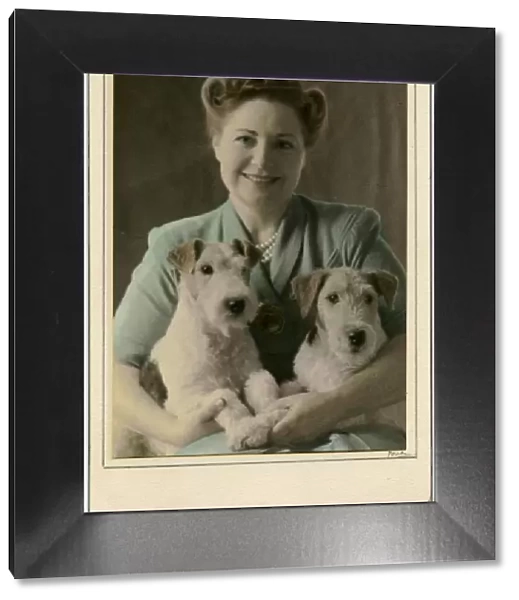 Woman with two Airedale Terrier dogs