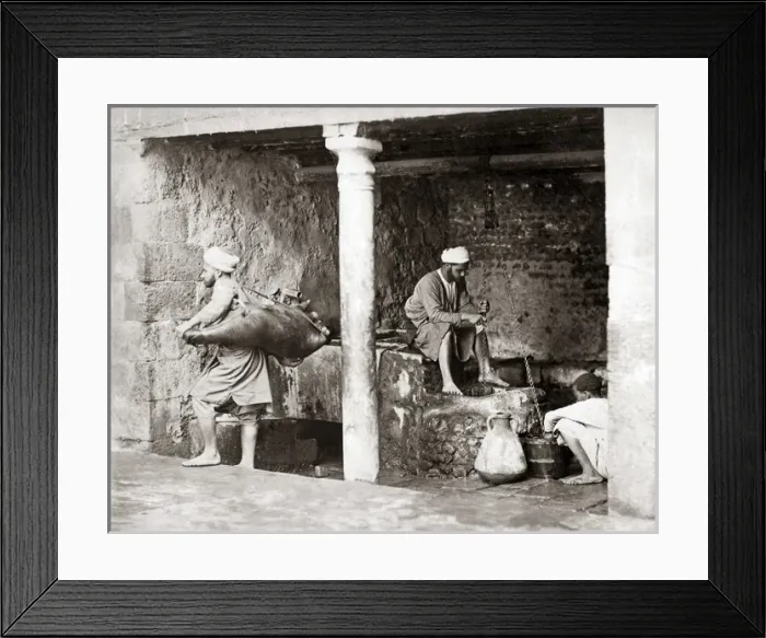 Framed Print : Water carriers filling their bags, Egypt, circa 1880 Framed Print : Water carriers filling their bags, Egypt, circa 1880