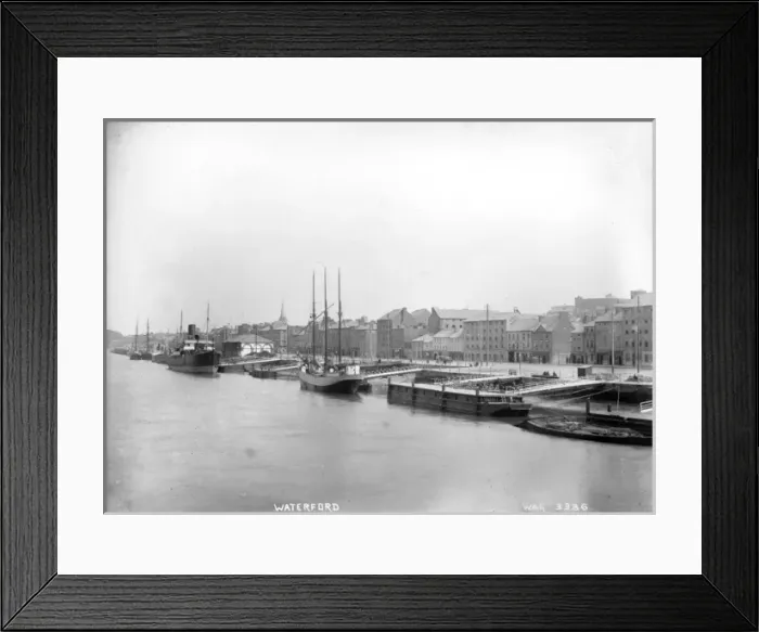 Framed Print : Waterford - an elevated view along the harbour with boats moored and the buildings behind Framed Print : Waterford - an elevated view along the harbour with boats moored and the buildings behind