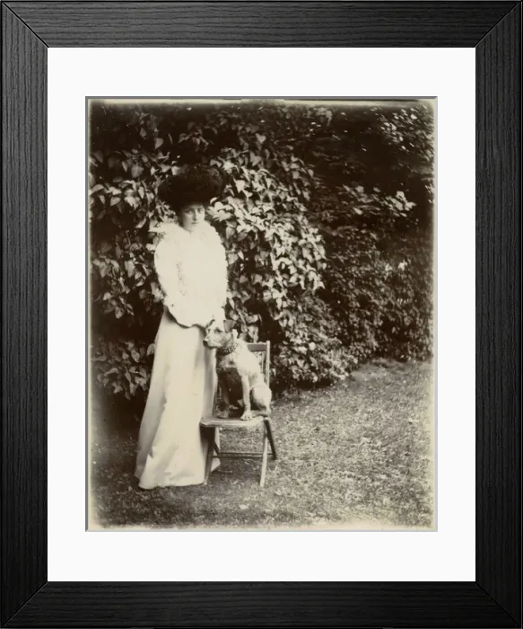Framed Print : Woman with terrier dog in a garden Framed Print : Woman with terrier dog in a garden