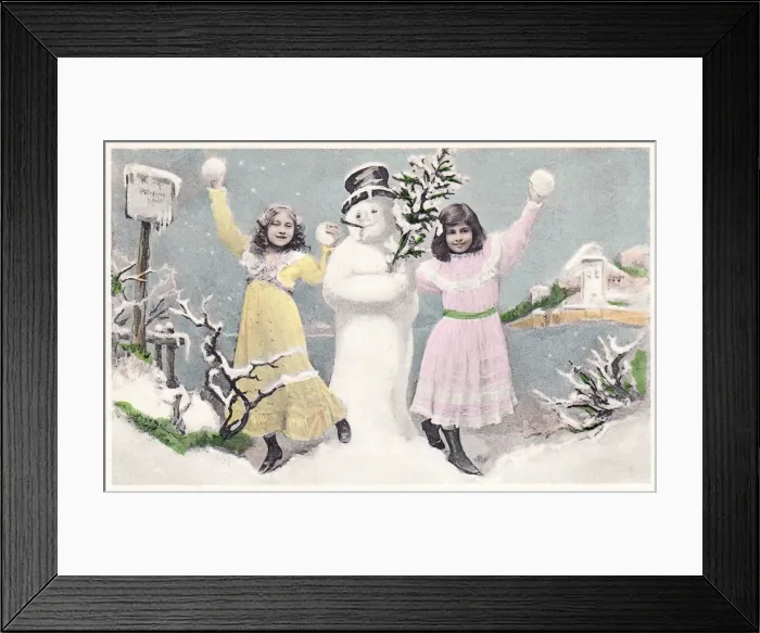 Framed Print : Two girls with snowman on a Christmas postcard Framed Print : Two girls with snowman on a Christmas postcard
