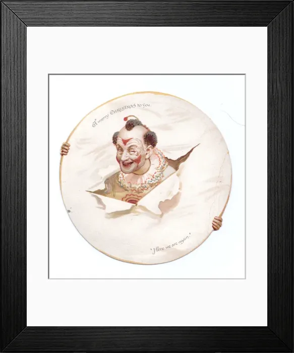 Framed Print : Clown with head through paper on a Christmas card Framed Print : Clown with head through paper on a Christmas card