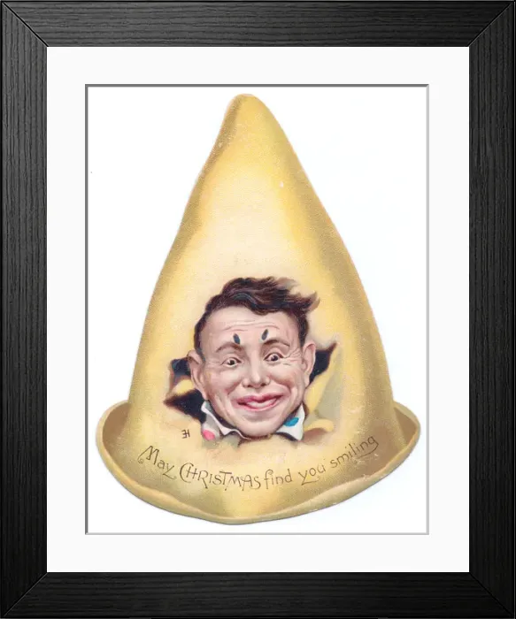 Framed Print : Clowns face on a hat-shaped Christmas card Framed Print : Clowns face on a hat-shaped Christmas card