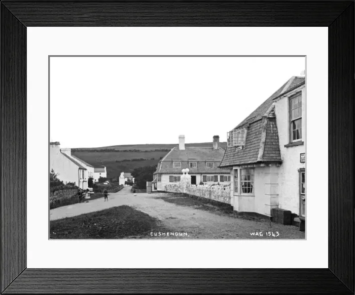 Framed Print : Cushendun - a view of the buildings and children in the street Framed Print : Cushendun - a view of the buildings and children in the street