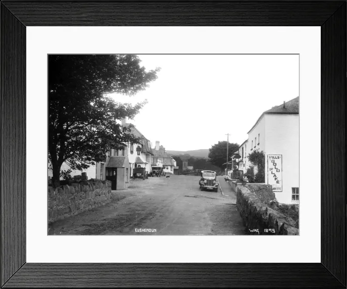 Framed Print : Cushendun - a view of the buildings and motor cars in the street Framed Print : Cushendun - a view of the buildings and motor cars in the street
