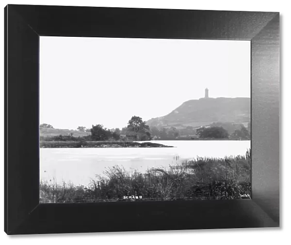 Scrabo - a view of the tower with water in the foreground