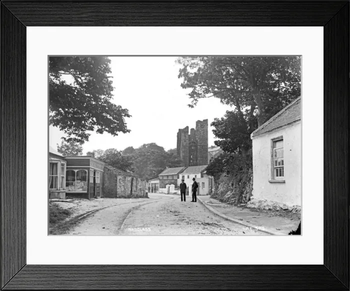 Framed Print : Ardglass - a view of the town looking up to the Castle with two men on the road Framed Print : Ardglass - a view of the town looking up to the Castle with two men on the road