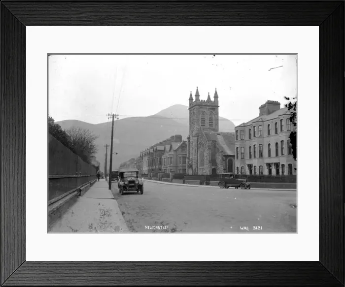 Framed Print : Newcastle - a low level view of the Main street with a Church to the right Framed Print : Newcastle - a low level view of the Main street with a Church to the right