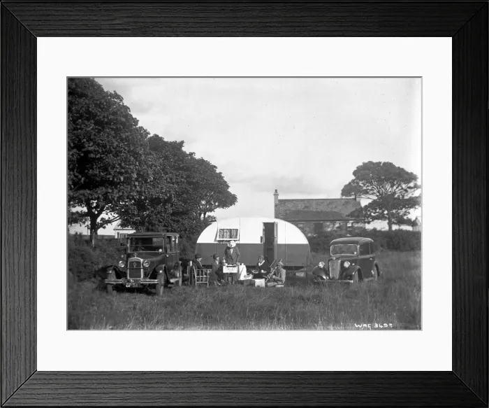 Framed Print : A group of five people having tea outside a caravan