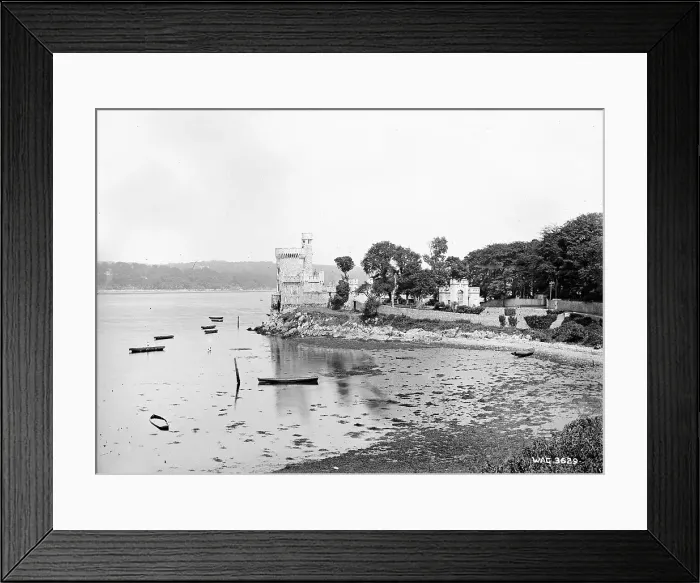 Framed Print : A side view of a Castle by the sea that appears to be Blackr Framed Print : A side view of a Castle by the sea that appears to be Blackr