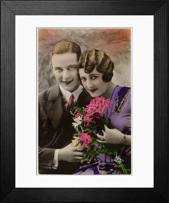 Framed Print : Kitsch New Years Greetings postcard featuring a young couple Framed Print : Kitsch New Years Greetings postcard featuring a young couple