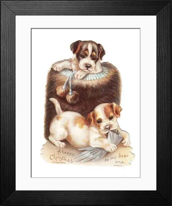 Framed Print : Two puppies with muff and glove on a cutout Christmas card Framed Print : Two puppies with muff and glove on a cutout Christmas card