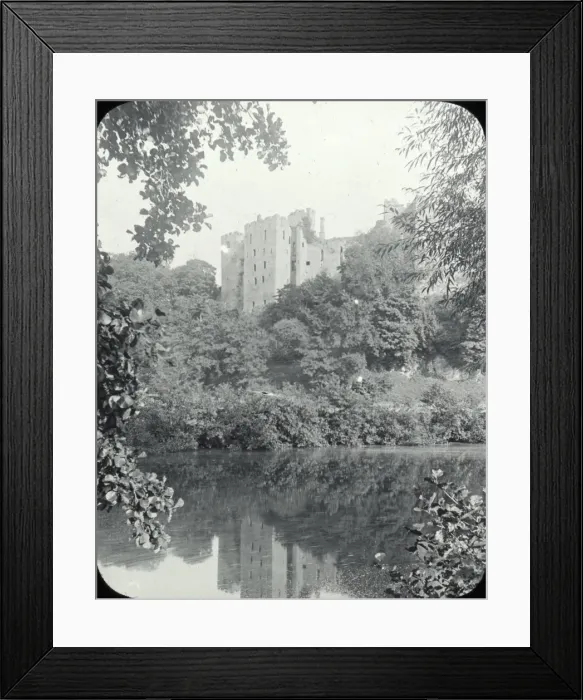 Framed Print : Ludlow - view across river, Ludlow castle behind trees. Framed Print : Ludlow - view across river, Ludlow castle behind trees.