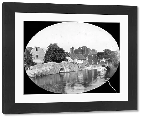 Eynsford. Small bridge over river, houses in background