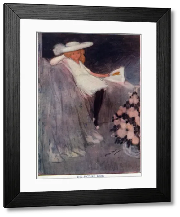 Framed Print : The Picture Book - A rather bored girl flicks through a tome Framed Print : The Picture Book - A rather bored girl flicks through a tome