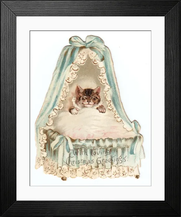 Framed Print : Cat in a cradle on a cutout Christmas card Framed Print : Cat in a cradle on a cutout Christmas card