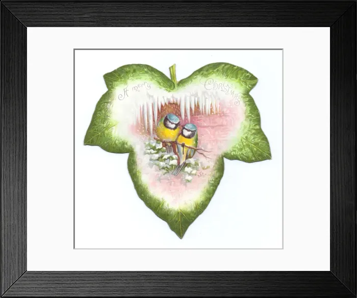 Framed Print : Christmas card in the shape of a green leaf with birds Framed Print : Christmas card in the shape of a green leaf with birds
