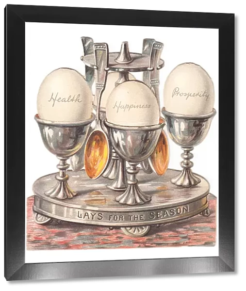 Eggcup stand with eggs on a cutout Christmas card