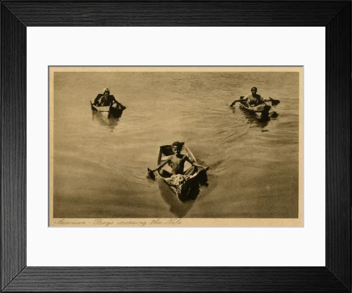 Framed Print : Aswan, Egypt - Three boys crossing the Nile in small boats Framed Print : Aswan, Egypt - Three boys crossing the Nile in small boats